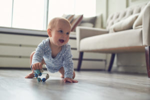 Baby crawling on a newly cleaned floor by ecomaids house cleaning services in Charlotte.