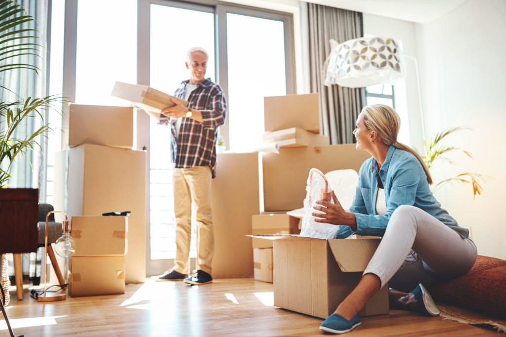 Family moving into a new home after receiving ecomaids move in / move out cleaning services in Naples.